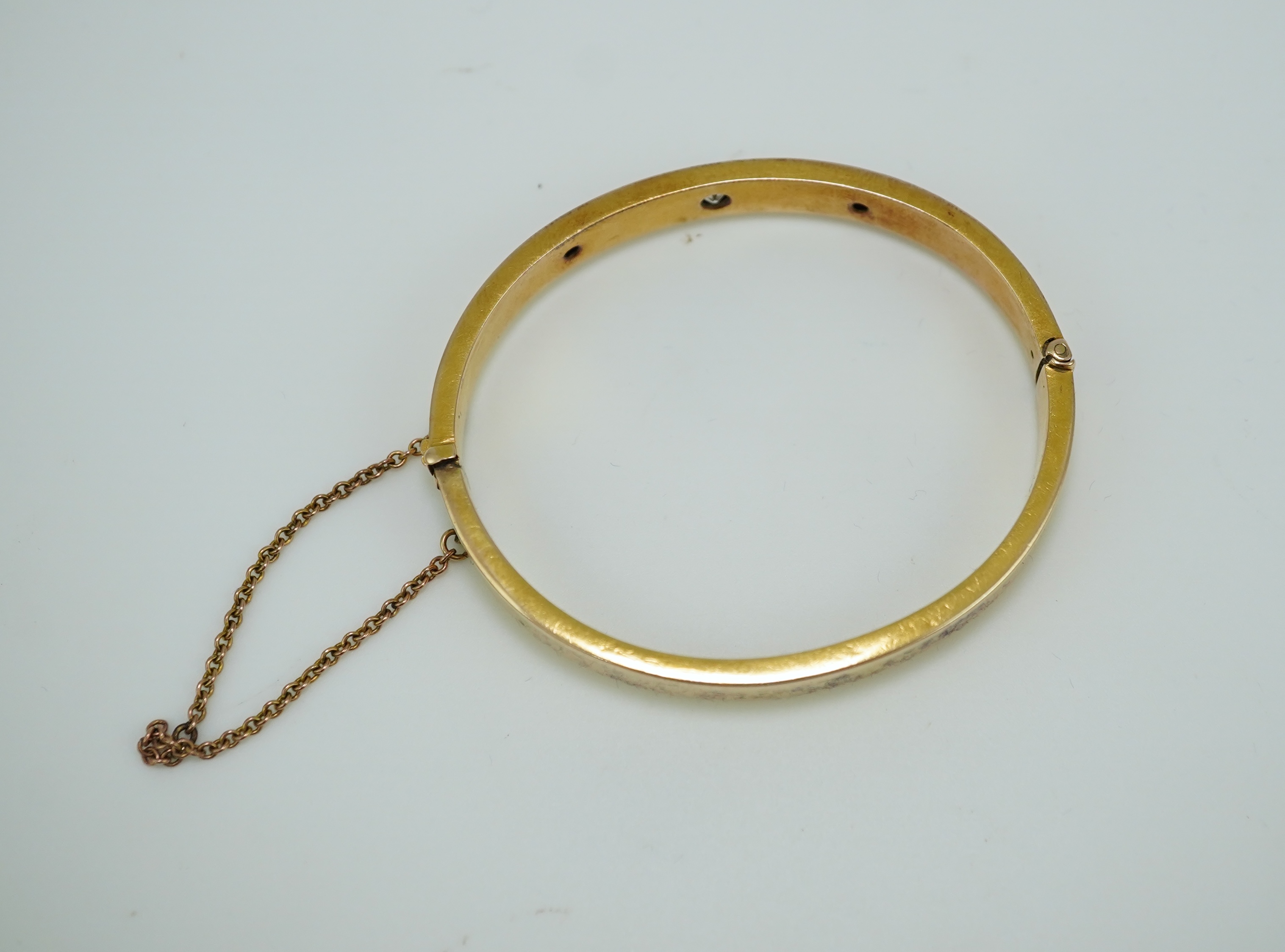 An Edwardian 15ct gold and diamond bangle, circa 1904